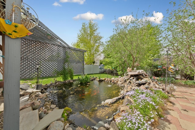1320 18th St SE, Owatonna, MN 55060 - view of yard with a garden pond