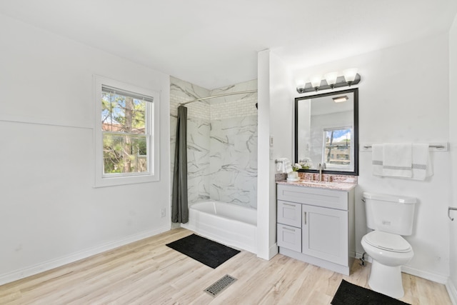 1775 Morgan Ave, Saint Paul, MN 55116 - full bathroom featuring wood finished floors, vanity, bathtub / shower combination, toilet, and baseboards