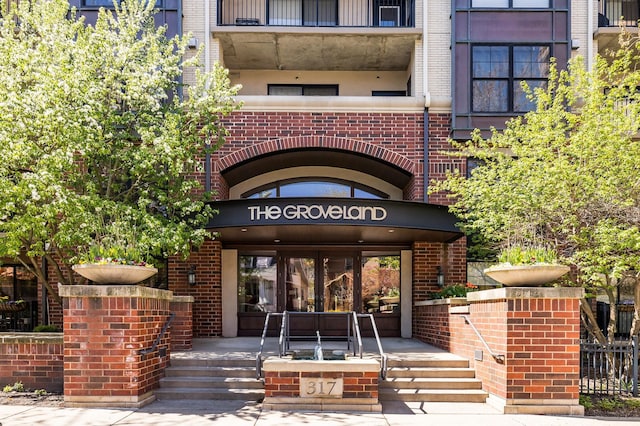 entrance to property with brick siding
