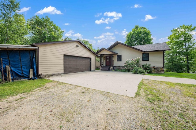 single story home with an outbuilding and a garage