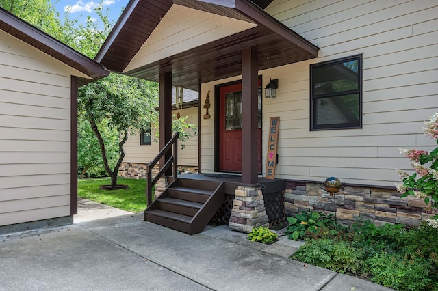 view of exterior entry featuring stone siding