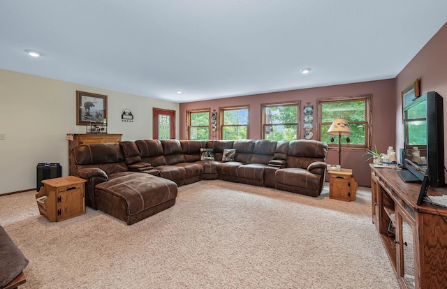 carpeted living area with recessed lighting