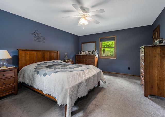 bedroom with carpet, baseboards, and a ceiling fan