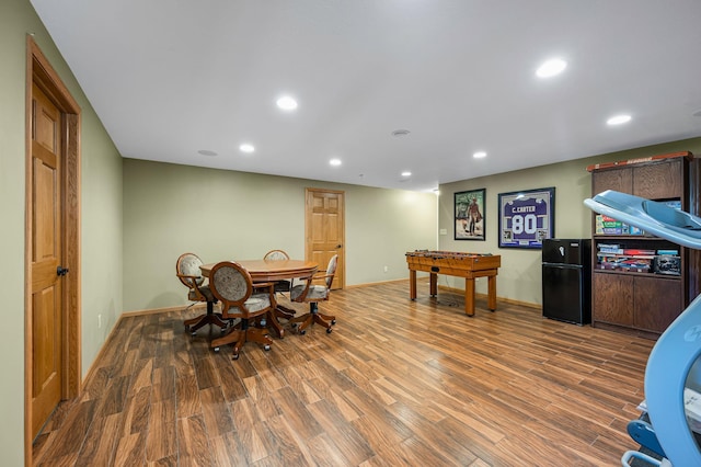recreation room featuring wood finished floors, baseboards, and recessed lighting