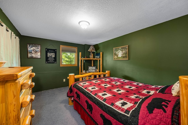 carpeted bedroom featuring a textured ceiling