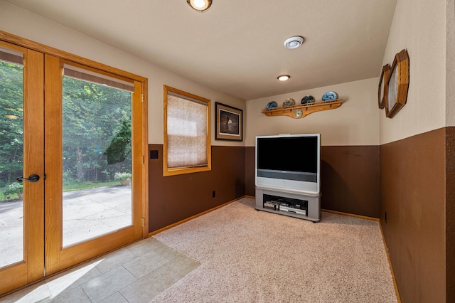 entryway with baseboards and french doors