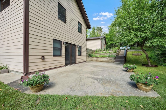 view of side of home featuring a patio