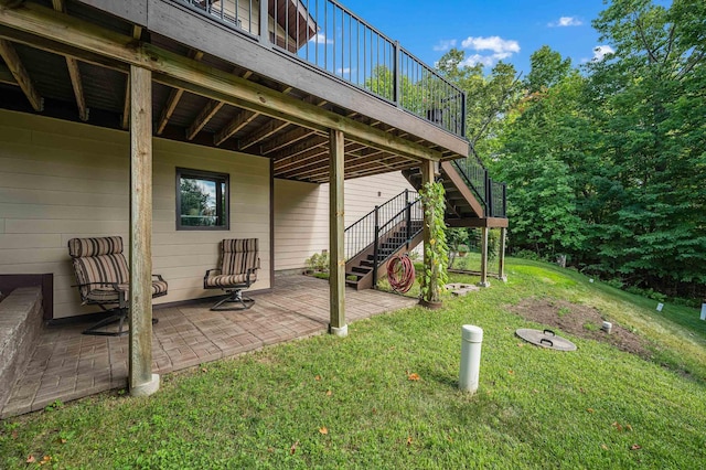 view of yard featuring a patio area, stairway, and a deck