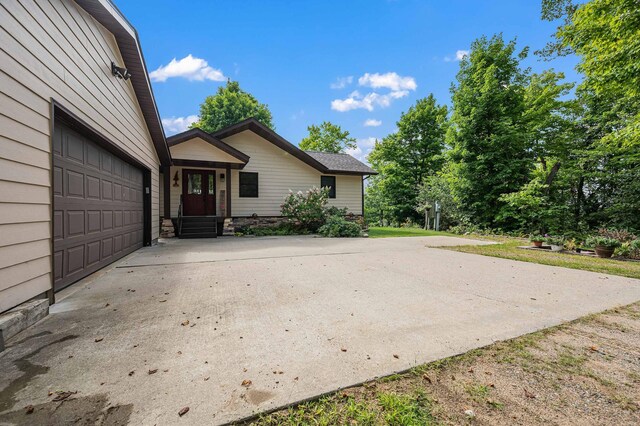 33627 Deer Lake Ln, Grand Rapids, MN 55744 - view of side of home with concrete driveway and an attached garage