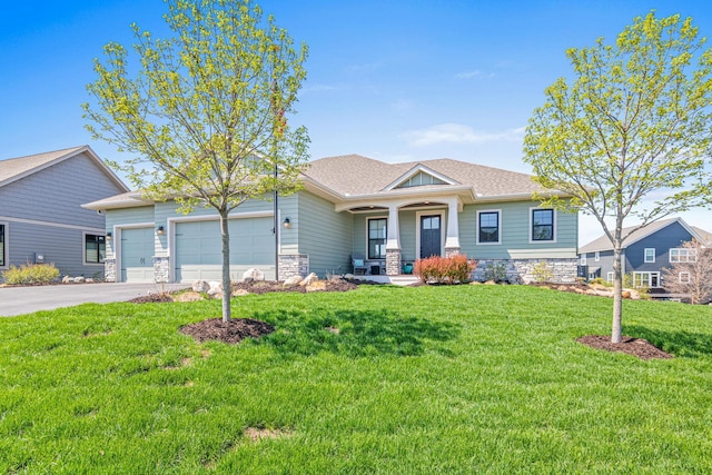 4152 Hummingbird Ct N, Lake Elmo, MN 55042 - craftsman inspired home with a garage, covered porch, asphalt driveway, and a front lawn