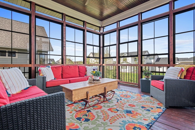 4152 Hummingbird Ct N, Lake Elmo, MN 55042 - sunroom with hardwood / wood-style flooring, healthy amount of natural light, a wooden deck, and a towering ceiling