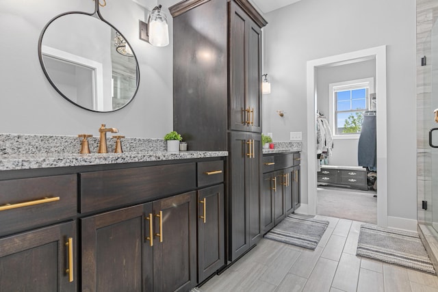 4152 Hummingbird Ct N, Lake Elmo, MN 55042 - full bath featuring vanity, a stall shower, and baseboards
