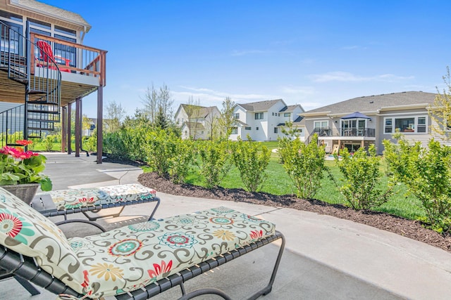 4152 Hummingbird Ct N, Lake Elmo, MN 55042 - view of patio featuring a residential view, stairs, and a wooden deck