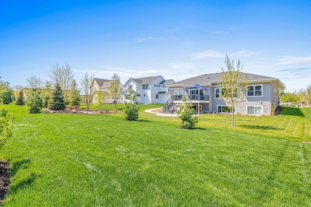 4152 Hummingbird Ct N, Lake Elmo, MN 55042 - back of house with a deck, stairs, a yard, and a residential view