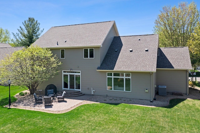 back of house featuring a patio, a lawn, and central air condition unit