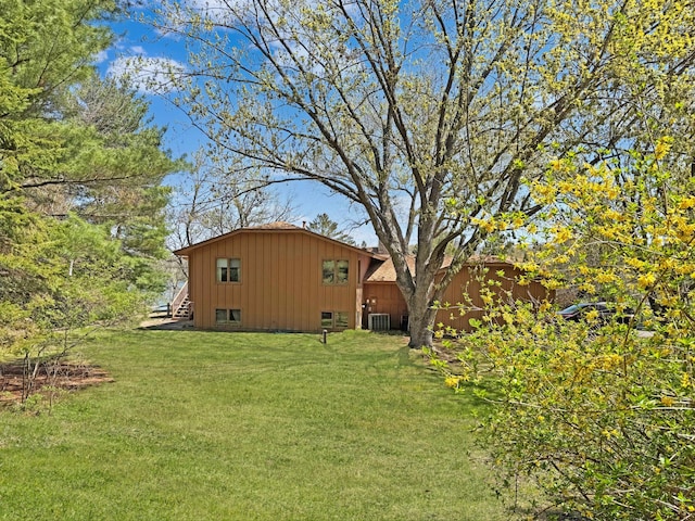 7864 Demontreville Trl N, Lake Elmo, MN 55042 - view of green lawn with central AC unit