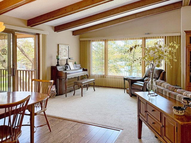 7864 Demontreville Trl N, Lake Elmo, MN 55042 - sitting room with healthy amount of natural light, beamed ceiling, and light colored carpet