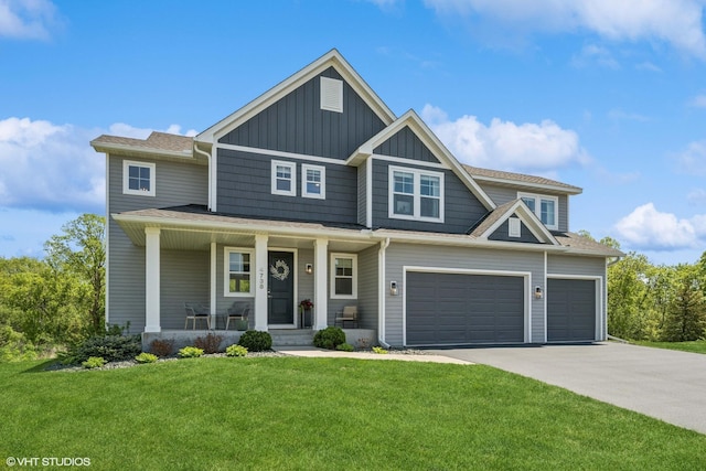 4738 Maas Ct, Minnetrista, MN 55375 - craftsman inspired home with board and batten siding, driveway, covered porch, a front yard, and an attached garage