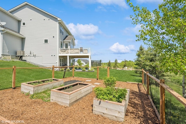 4738 Maas Ct, Minnetrista, MN 55375 - view of yard featuring a vegetable garden and a wooden deck