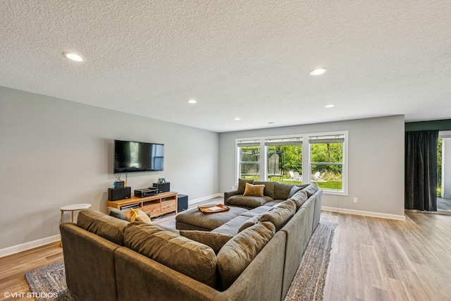 4738 Maas Ct, Minnetrista, MN 55375 - living room featuring light wood-type flooring, a textured ceiling, baseboards, and recessed lighting