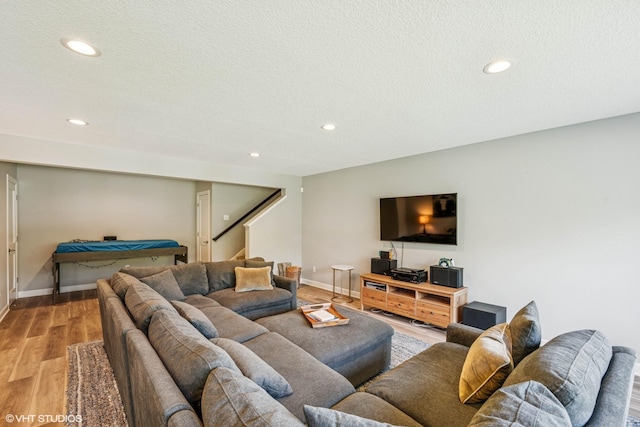 4738 Maas Ct, Minnetrista, MN 55375 - living area featuring light wood-style floors, recessed lighting, stairs, baseboards, and a textured ceiling