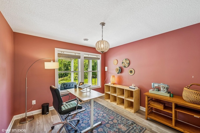 4738 Maas Ct, Minnetrista, MN 55375 - office area featuring wood finished floors, a textured ceiling, baseboards, and a chandelier