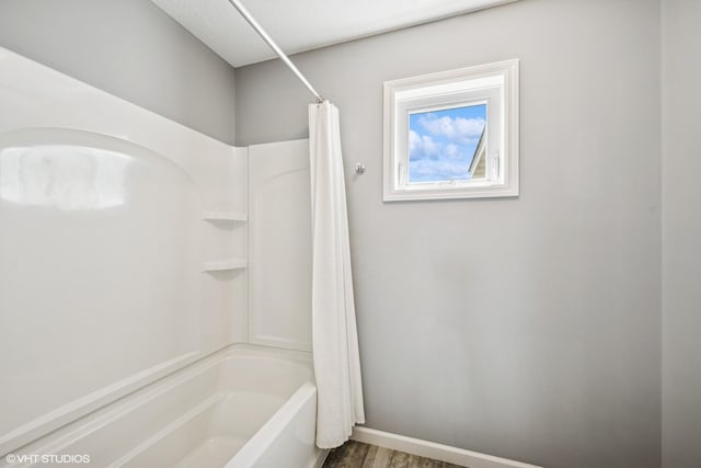 4738 Maas Ct, Minnetrista, MN 55375 - full bath with shower / bath combination with curtain and wood finished floors