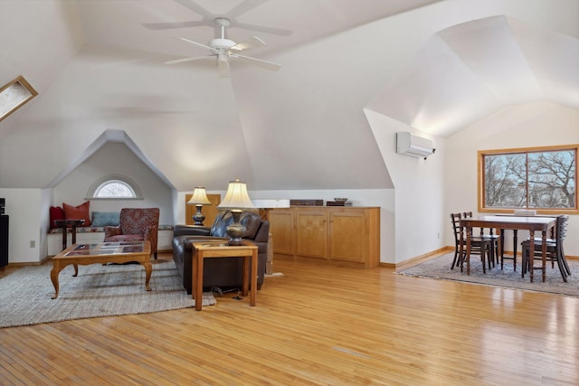 1203 Mount Curve Ave, Minneapolis, MN 55403 - interior space with lofted ceiling, a wall mounted air conditioner, light wood-type flooring, and a ceiling fan