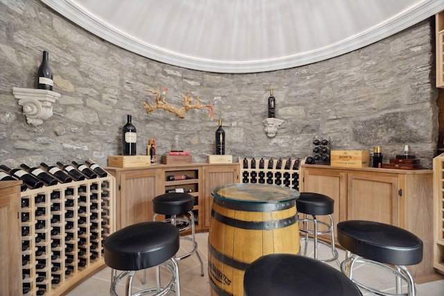 1203 Mount Curve Ave, Minneapolis, MN 55403 - wine room featuring a dry bar and light tile patterned floors