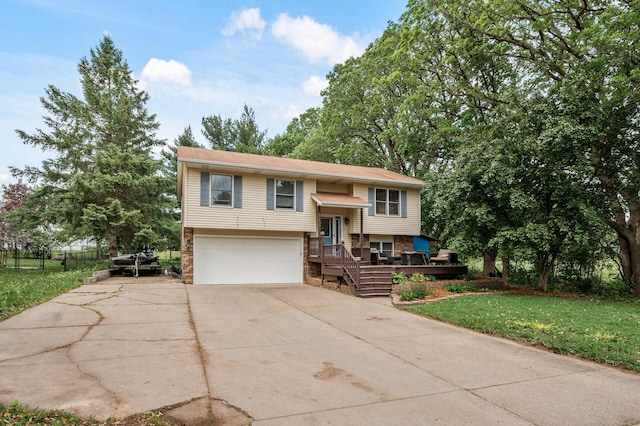 14250 Upper 54th St N, Oak Park Heights, MN 55082 - raised ranch with a garage, driveway, brick siding, and a front lawn