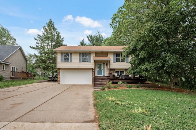 14250 Upper 54th St N, Oak Park Heights, MN 55082 - split foyer home with concrete driveway, a garage, and a front yard