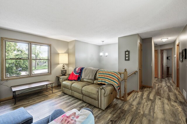 14250 Upper 54th St N, Oak Park Heights, MN 55082 - living area with wood finished floors, baseboards, and a chandelier