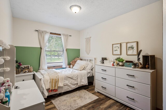 14250 Upper 54th St N, Oak Park Heights, MN 55082 - bedroom featuring dark wood-type flooring and a textured ceiling