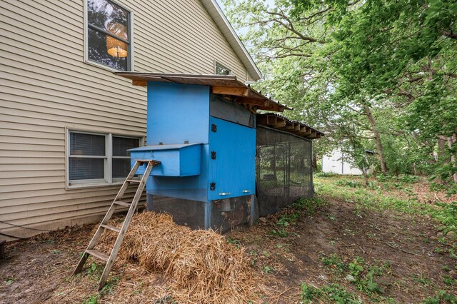 14250 Upper 54th St N, Oak Park Heights, MN 55082 - view of home's exterior with exterior structure and an outdoor structure