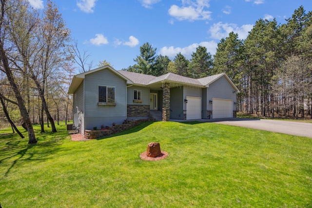 single story home with aphalt driveway, an attached garage, stone siding, a front yard, and cooling unit