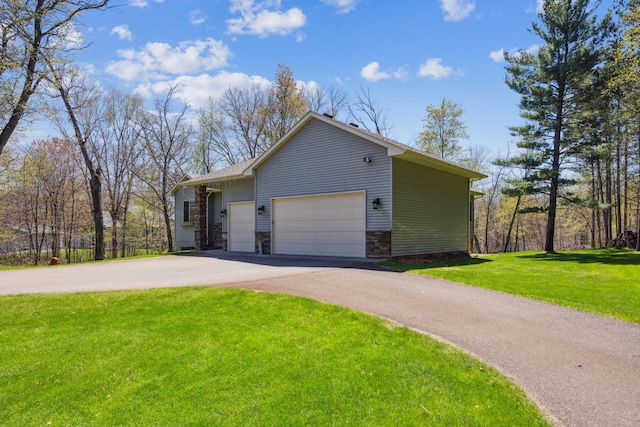 view of property exterior with stone siding, a yard, driveway, and a garage