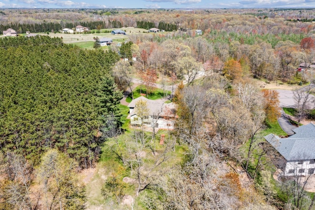 drone / aerial view featuring a forest view