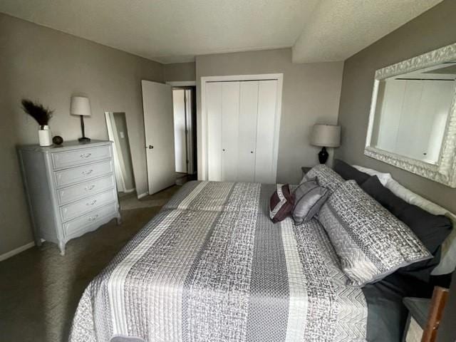 bedroom featuring a closet, baseboards, and carpet floors