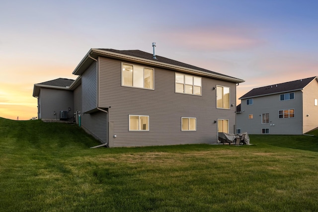 7107 184th St W, Lakeville, MN 55044 - back of house featuring a yard and cooling unit