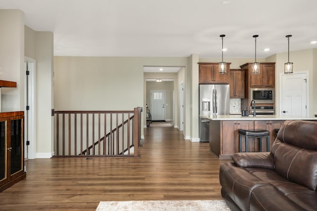 7107 184th St W, Lakeville, MN 55044 - living room with dark wood-type flooring, baseboards, and recessed lighting
