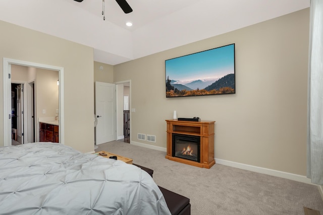 7107 184th St W, Lakeville, MN 55044 - bedroom featuring carpet, baseboards, a glass covered fireplace, ensuite bath, and a ceiling fan