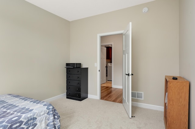 7107 184th St W, Lakeville, MN 55044 - carpeted bedroom featuring baseboards and washer / dryer