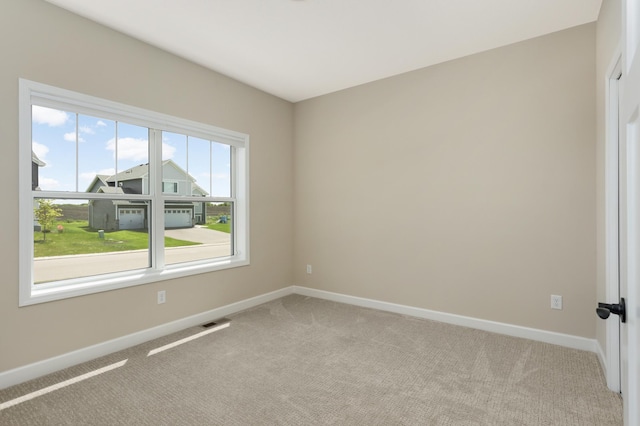 7107 184th St W, Lakeville, MN 55044 - empty room featuring light colored carpet and baseboards