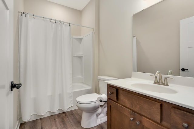 7107 184th St W, Lakeville, MN 55044 - bathroom featuring vanity, wood finished floors, shower / bathtub combination with curtain, and toilet