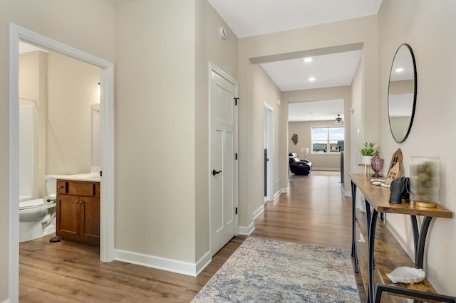 7107 184th St W, Lakeville, MN 55044 - hall with wood finished floors, baseboards, and recessed lighting