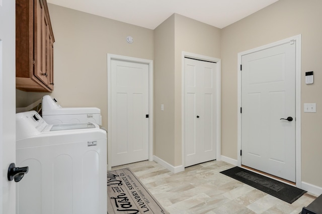 7107 184th St W, Lakeville, MN 55044 - laundry area featuring cabinet space, independent washer and dryer, and baseboards