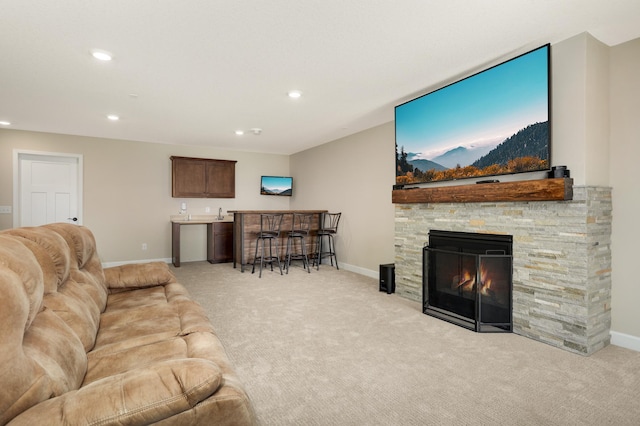 7107 184th St W, Lakeville, MN 55044 - living area featuring light colored carpet, recessed lighting, baseboards, bar area, and a fireplace