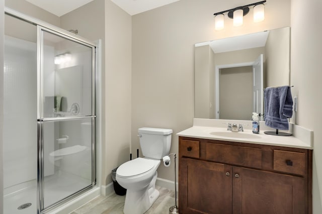 7107 184th St W, Lakeville, MN 55044 - full bathroom with toilet, a shower stall, vanity, and baseboards