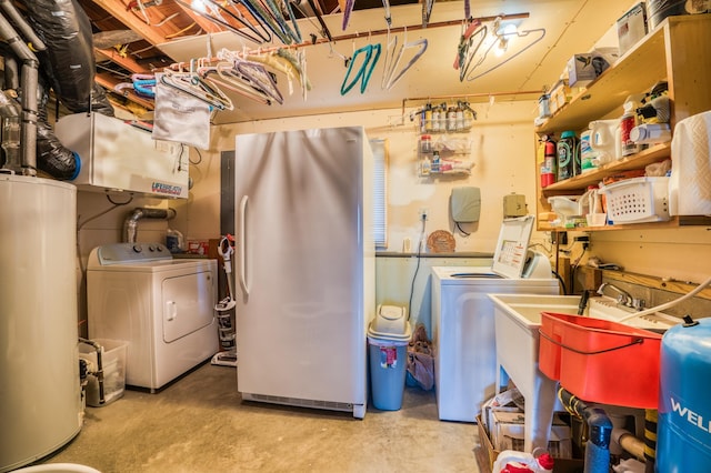 laundry room with washer and dryer, laundry area, gas water heater, and a sink