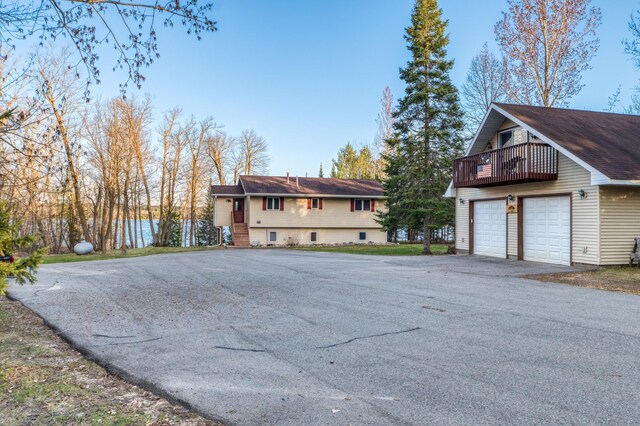32061 Primrose Ln, Walker, MN 56461 - view of side of property with a garage and a balcony
